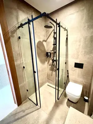 a bathroom with a shower and a toilet at Lovely condo Marrakech city center terrasse garage in Marrakech