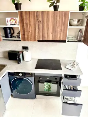 a kitchen with a washing machine in a kitchen at Lovely condo Marrakech city center terrasse garage in Marrakech