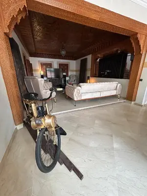 a motorcycle parked in a room with a living room at Villa in marrakech city center with heated pool and breakfast inclued in Marrakech