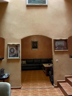 a living room with a couch and a table at Riad Red Diamond in Marrakech