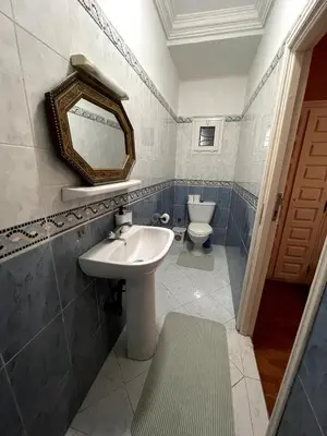a bathroom with a sink and a toilet at Riad Red Diamond in Marrakech