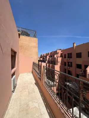 a balcony with a railing next to some buildings at Stunning 2BR in Top Location Marrakech City Center in Marrakech