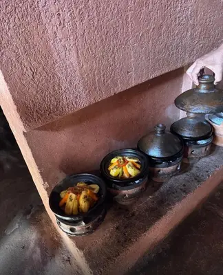 a group of bowls of food sitting on a shelf at Atlas Mountains 3 Valleys Experience All-Inclusive Private Tour from Marrakesh in Marrakech