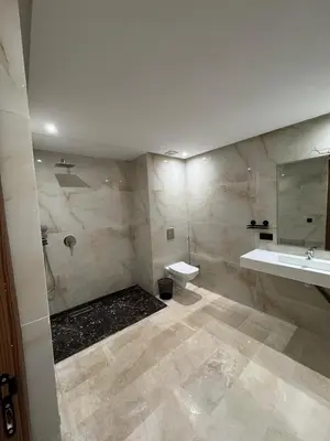 a bathroom with a sink and a toilet and a mirror at for you - perfect place in Marrakech