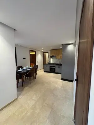 a living room and kitchen with a table and chairs at for you - perfect place in Marrakech