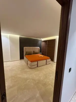 a bedroom with a bed with an orange blanket at for you - perfect place in Marrakech