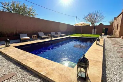 a swimming pool in the backyard of a house at Villa Léa in Marrakech