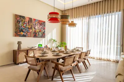 a dining room with a table and chairs at Berber Garden in Aït Amara