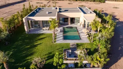 an aerial view of a house with a swimming pool at Berber Garden in Aït Amara