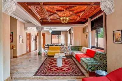 a living room with a couch and a table at Luxury Beldi & Piscine at Villa Riad El Menzeh in Marrakech