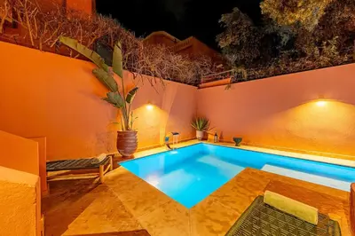 a large swimming pool in a room with at Luxury Beldi & Piscine at Villa Riad El Menzeh in Marrakech