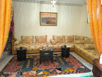 a living room with a couch and a table at Riad DAR BARBI in Marrakech
