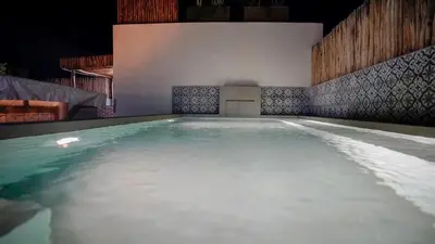 a swimming pool with white water in a room at Manzil Fanny Private Riad & Spa in Marrakech