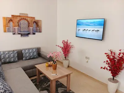 a living room with a couch and a table at Appartement Lady Plaza 1 in Marrakech