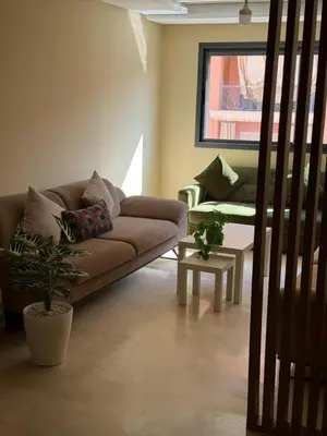 a living room with a couch and a table at Etoile De Marrakech in Marrakech
