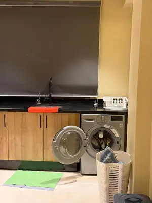 a kitchen with a washing machine in a room at Etoile De Marrakech in Marrakech