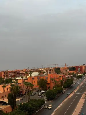 a view of a city with cars driving down a street at Hivernage & Gueliz Luxury Apt Pool near medina in Marrakech
