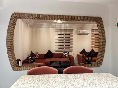 a living room with a couch and a table at appartement en résidence in Marrakech
