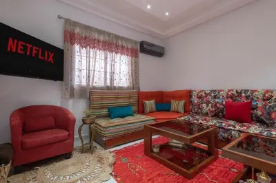a living room with a couch and a chair at Dar Choway in Marrakech