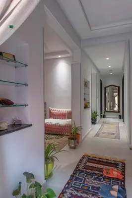 a living room with a couch and a rug at Dar Choway in Marrakech