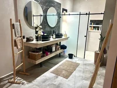 a bathroom with a sink and a mirror at Villa Lam in Marrakech
