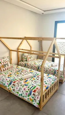 a bedroom with two bunk beds in a room at Villa Lam in Marrakech