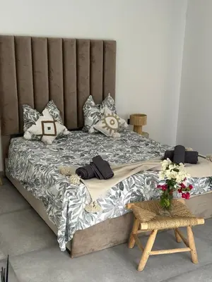 a large bed in a room with flowers on it at Villa Lam in Marrakech