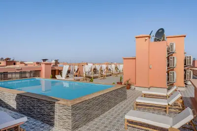 a pool on the roof of a building at Appartement Deluxe 2 chambres GUELIZ, Piscines, Spa, Gym in Marrakech