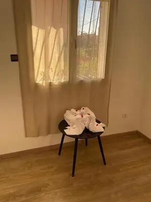 a chair with a towel on it in front of a window at jhome in Marrakech
