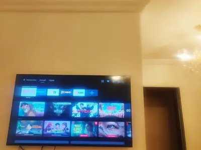 a flat screen tv hanging on a wall at Appartement cosy Marrakech in Marrakech