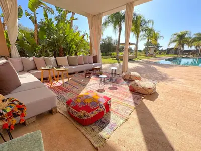a living room with a couch and a table at Palais Meryem in Marrakech