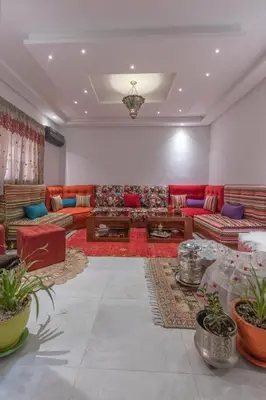 a large living room with couches and tables at Dar Choway Ground Floor Apartment in Marrakech