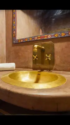 a sink in a bathroom with a faucet at RIAD SYMPA dans residence in Marrakech