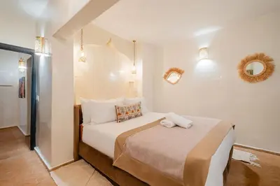 a bedroom with a large bed in a room at Riad Sohayna with Rooftop Pool 3BR Oasis in Marrakech