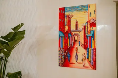 a painting of a city on a wall at Riad Sohayna with Rooftop Pool 3BR Oasis in Marrakech