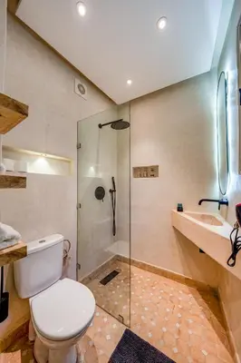 a bathroom with a toilet and a shower and a sink at Riad Exotika a Oasis with Pool, 7 min to Jemaa El Fna in Marrakech