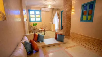 a living room with a couch and a table at riad Orazur in Marrakech