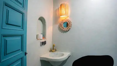 a bathroom with a sink and a mirror at riad Orazur in Marrakech