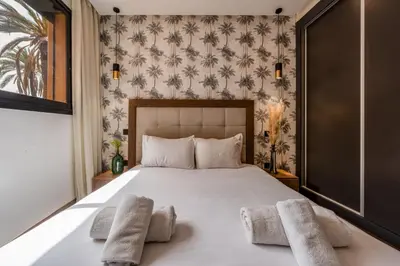 a bedroom with a bed with two towels on it at Élégance et Confort au Centre de Marrakech - Hivernage in Marrakech