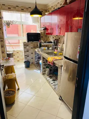 a kitchen with a refrigerator and a counter top at Moroccan-style apartment rental in Marrakech in Marrakech