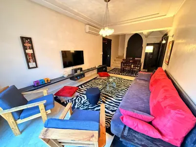 a living room with a couch and chairs at Gueliz 2 BR Duplex - Terrace - Wi-Fi - Train station in Marrakech