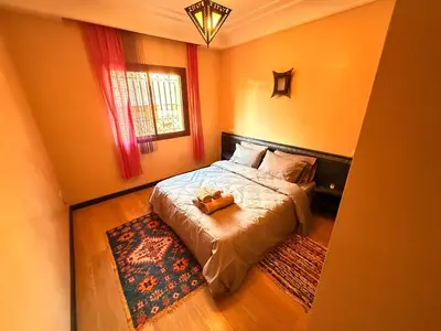 a bedroom with a bed with a teddy bear on it at Gueliz 2 BR Duplex - Terrace - Wi-Fi - Train station in Marrakech