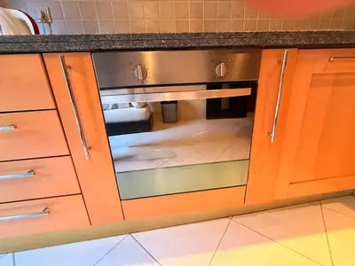 a kitchen with an oven in a kitchen at Gueliz 2 BR Duplex - Terrace - Wi-Fi - Train station in Marrakech