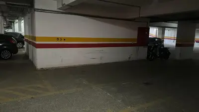 a garage with cars parked in a parking lot at Gueliz 2 BR Duplex - Terrace - Wi-Fi - Train station in Marrakech
