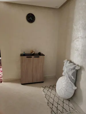 a corner of a room with a clock on the wall at arrive as a guest , turn to a local in Marrakech