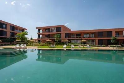 a large pool of water in front of a building at Amal Cozy - Modern Design, 4 Pools & HD Wifi in Marrakech