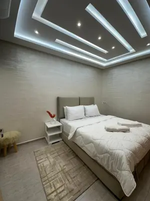 a bedroom with a large bed in a room at Chic appartement Marrakech in Marrakech