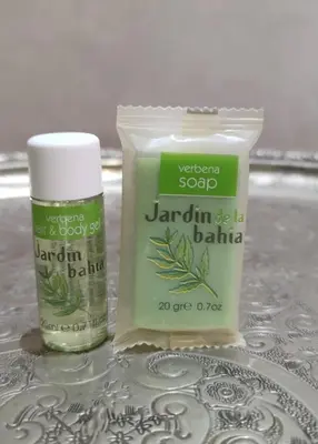 a bottle of kerrigan soap and a container of tarim balapa at Chic appartement Marrakech in Marrakech