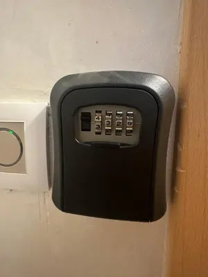 a remote control attached to a door of a bathroom at Chic appartement Marrakech in Marrakech