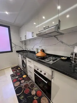 a kitchen with a stove and a stove top oven at Chic appartement Marrakech in Marrakech